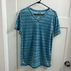 On the Byas Teal and Black striped shirt.